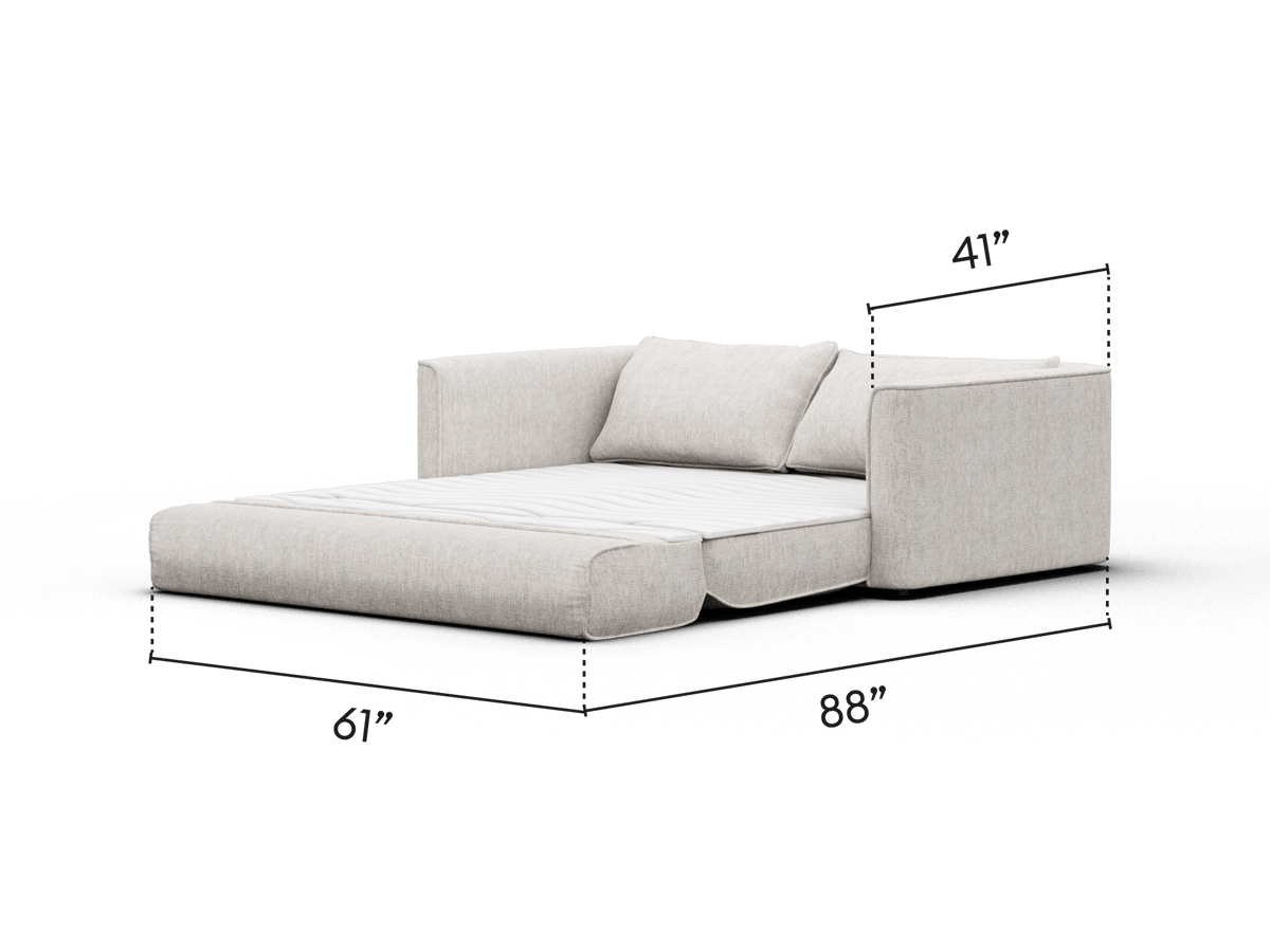 Luxurious sofa bed in soft beige fabric, featuring plush cushions and wide armrests. Sleek design with hidden bed frame, ideal for a modern living room.