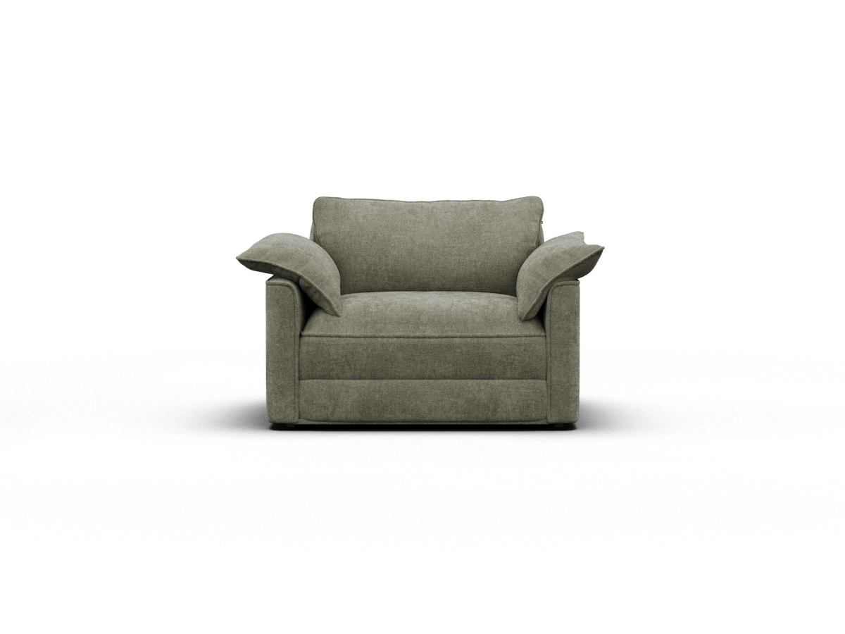 Modern armchair in soft, olive green upholstery with plush cushioning and wide armrests, set against a minimalist backdrop for a contemporary living space.