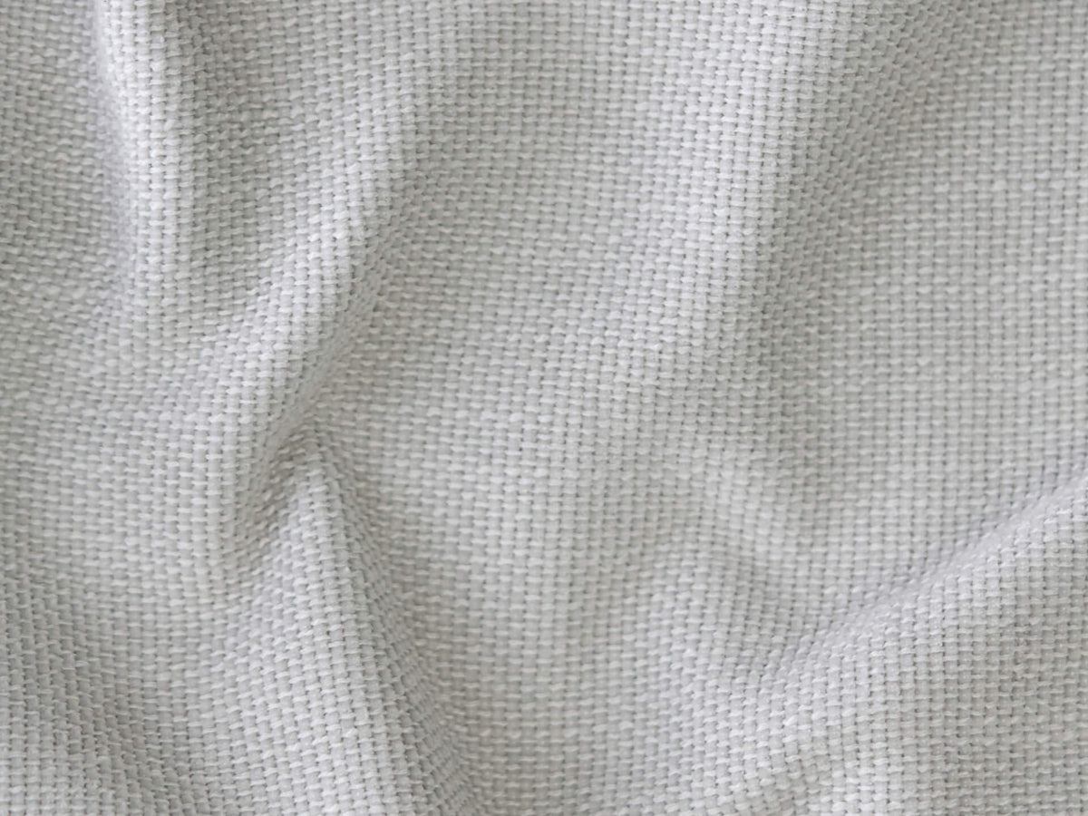Beige woven linen fabric with a soft, textured surface, ideal for upholstery or curtains. Modern aesthetic, complements minimalist or contemporary settings.