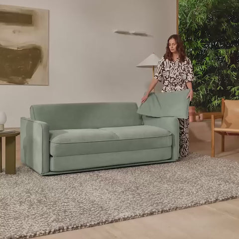 Woman unfolding the Koala Sofa Bed